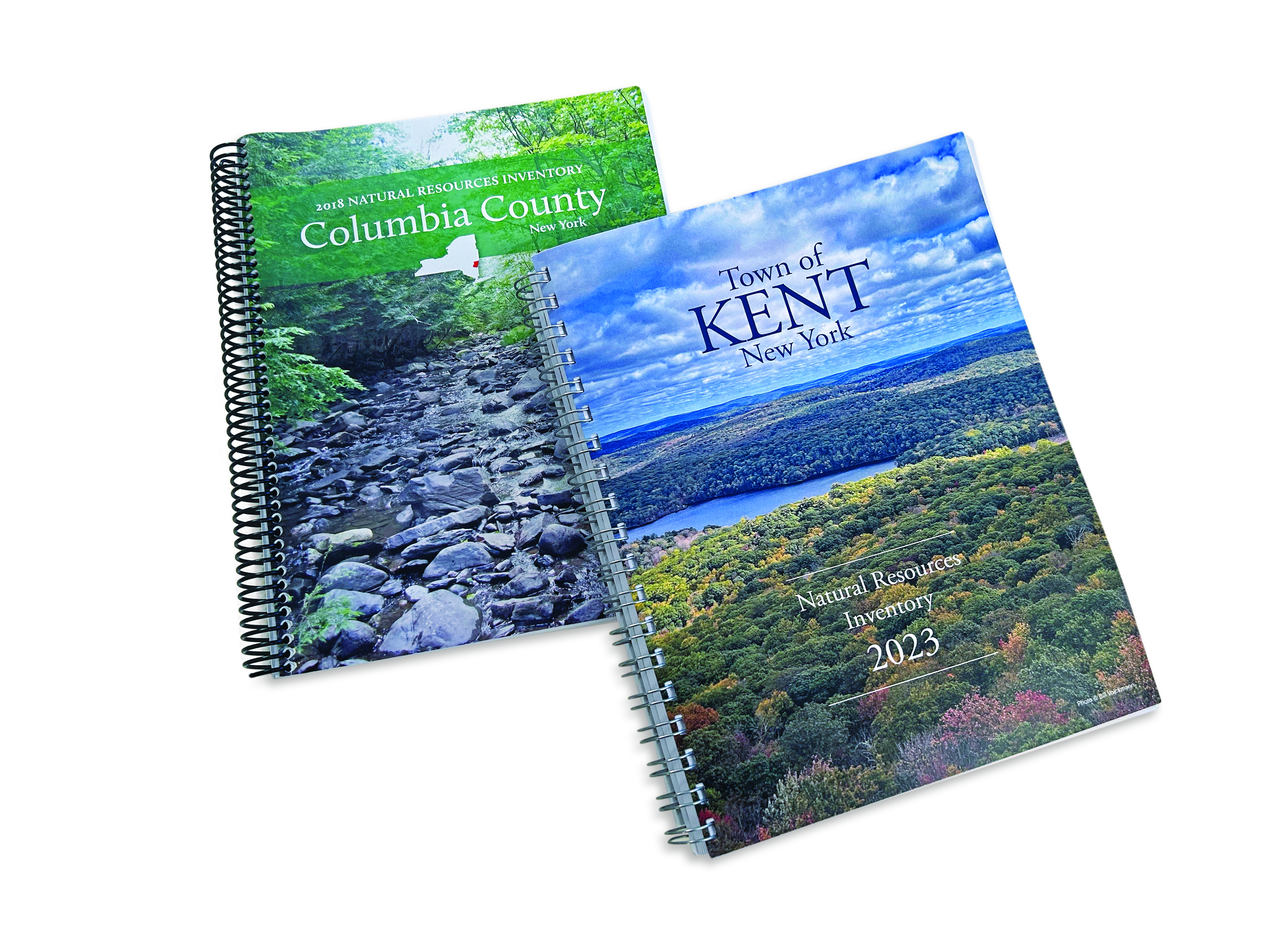 covers of two wiro-bound books with landscapes on the cover